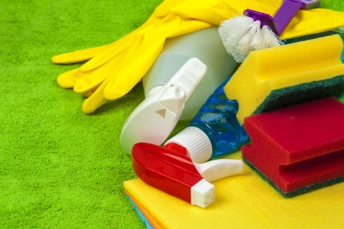 Cleaner wearing PPE while carrying out a safe cleaning task